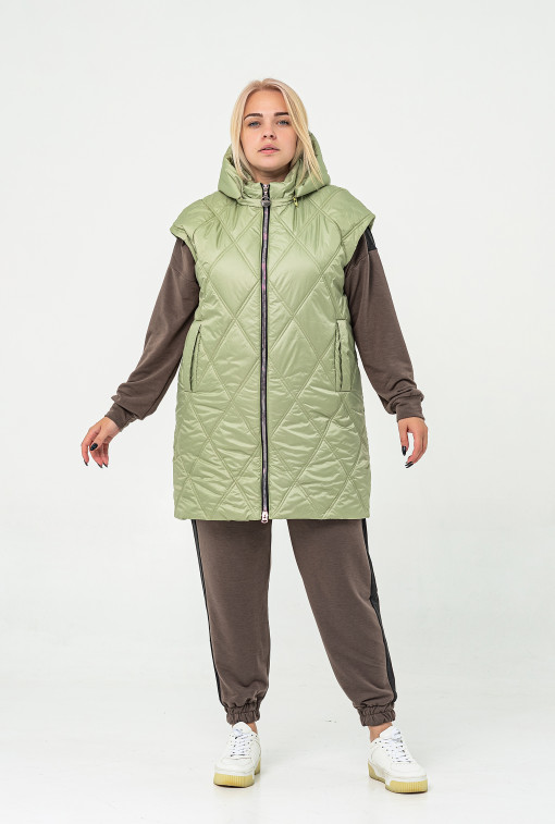 Подовжена жіноча безрукавка горохового кольору